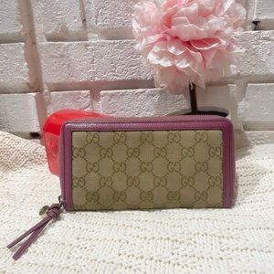 Authentic Gucci zippy wallet brown monogram with violet